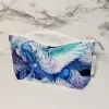 Pegasus mystical creature theme with metallic fabric accents. Structured box bottom accessory bag. Lined with white fabric and matching zipper. Convenient zipper pull. 100% Cotton fabric. Measures 8.5 inches wide, 5 inches tall.