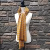 Lightweight fall or spring scarf. orange and gray plaid pattern with fringed ends. 72 inches long.