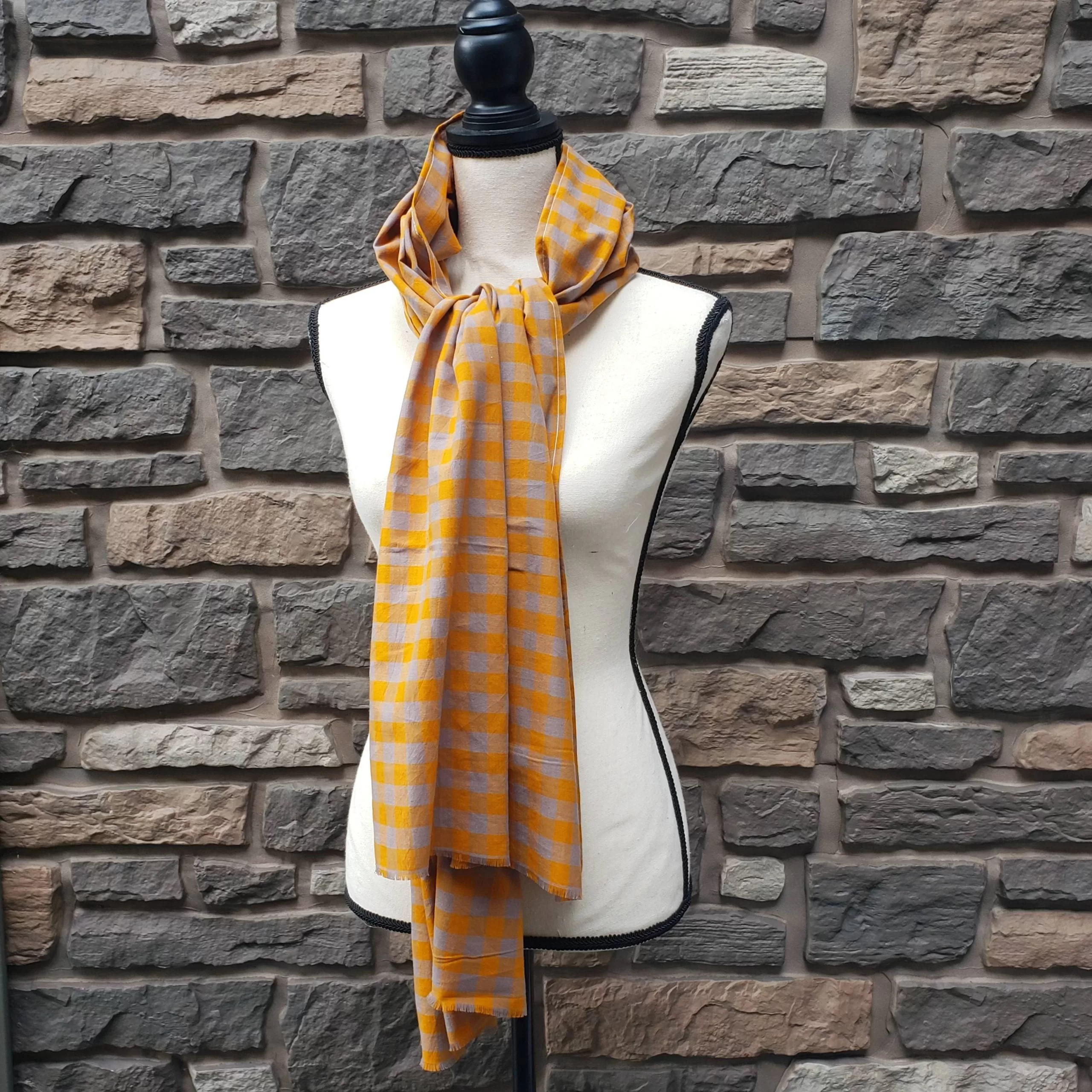 Lightweight fall or spring scarf. orange and gray plaid pattern with fringed ends. 72 inches long.