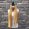 Lightweight fall or spring scarf. orange and gray plaid pattern with fringed ends. 72 inches long.