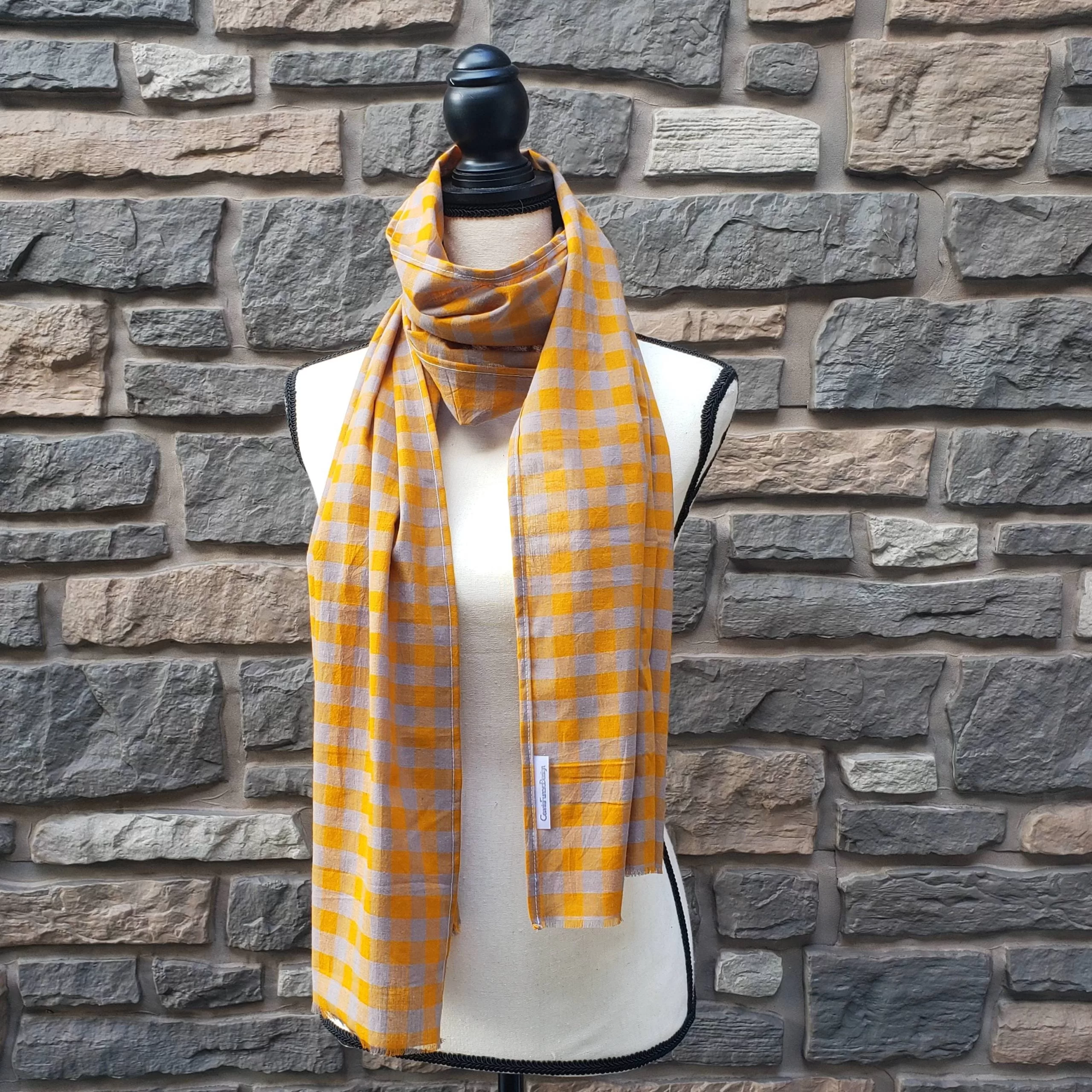 Lightweight fall or spring scarf. orange and gray plaid pattern with fringed ends. 72 inches long.