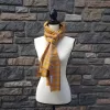Lightweight fall or spring scarf. orange and gray plaid pattern with fringed ends. 72 inches long.