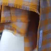 Lightweight fall or spring scarf. orange and gray plaid pattern with fringed ends. 72 inches long.