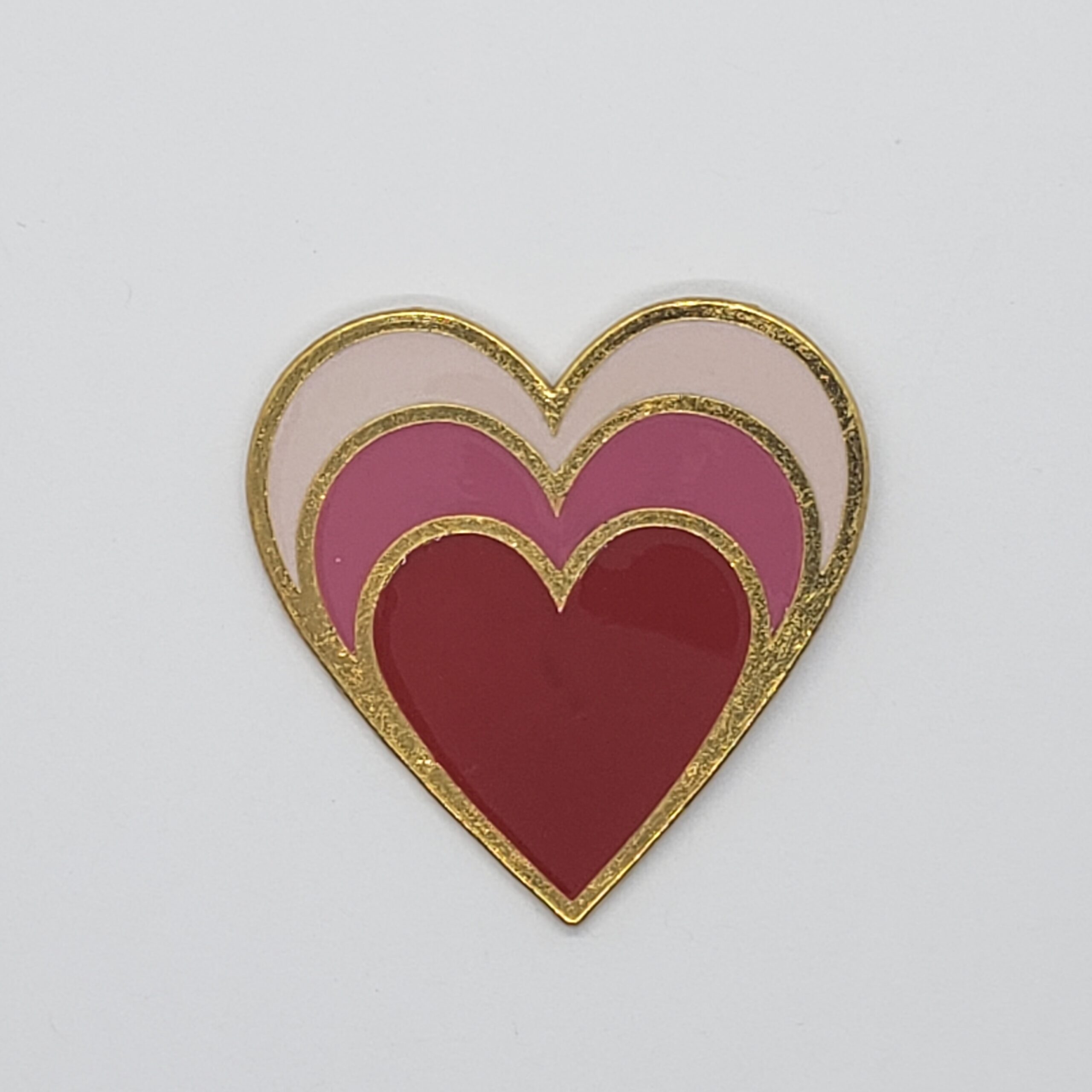large enamel heart pin. triple heart design. 1.75 inches. Red and pink. Gold tone back
