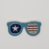 retro enamel pin. sunglasses shape. red white and blue with stars and stripes. 2 inches wide
