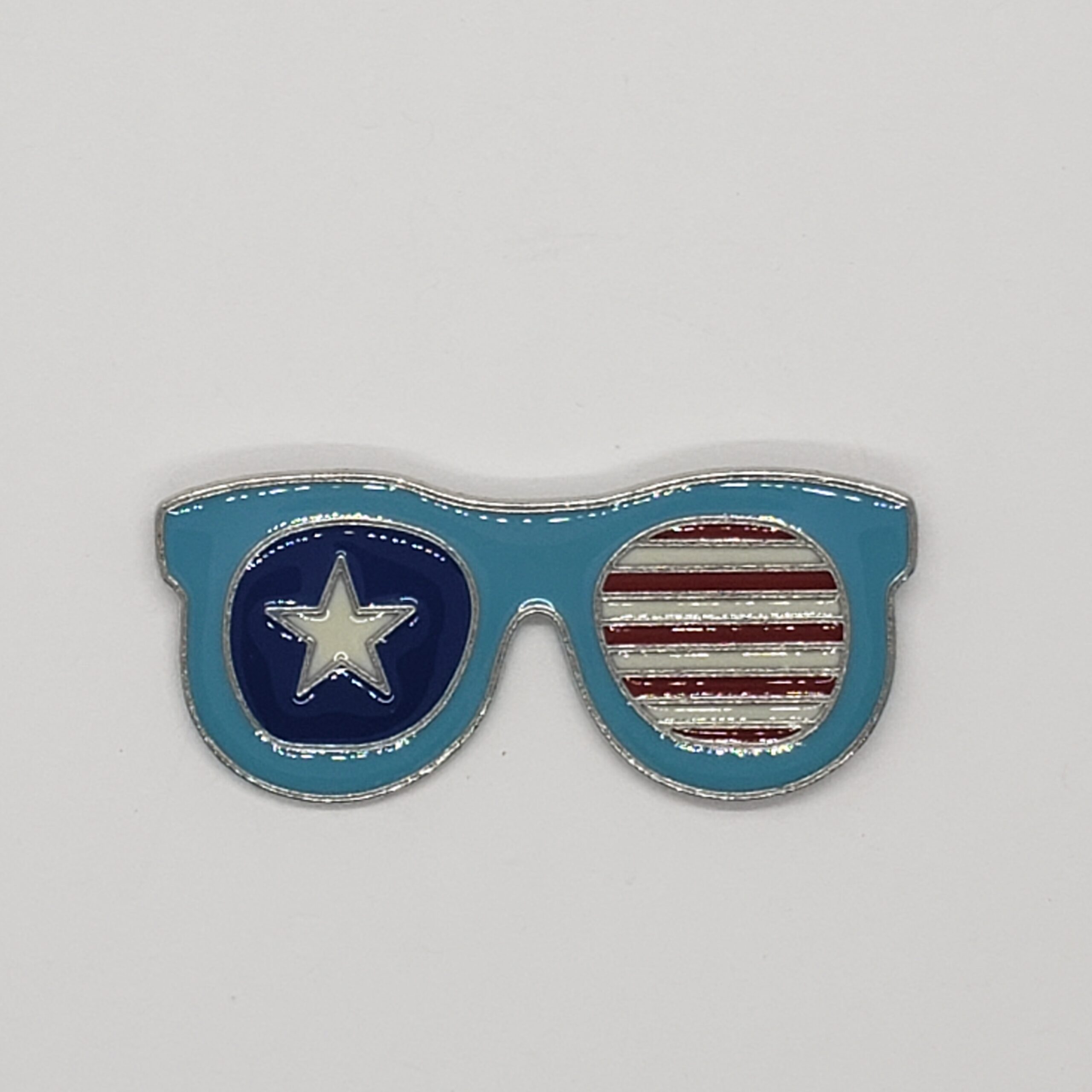 retro enamel pin. sunglasses shape. red white and blue with stars and stripes. 2 inches wide