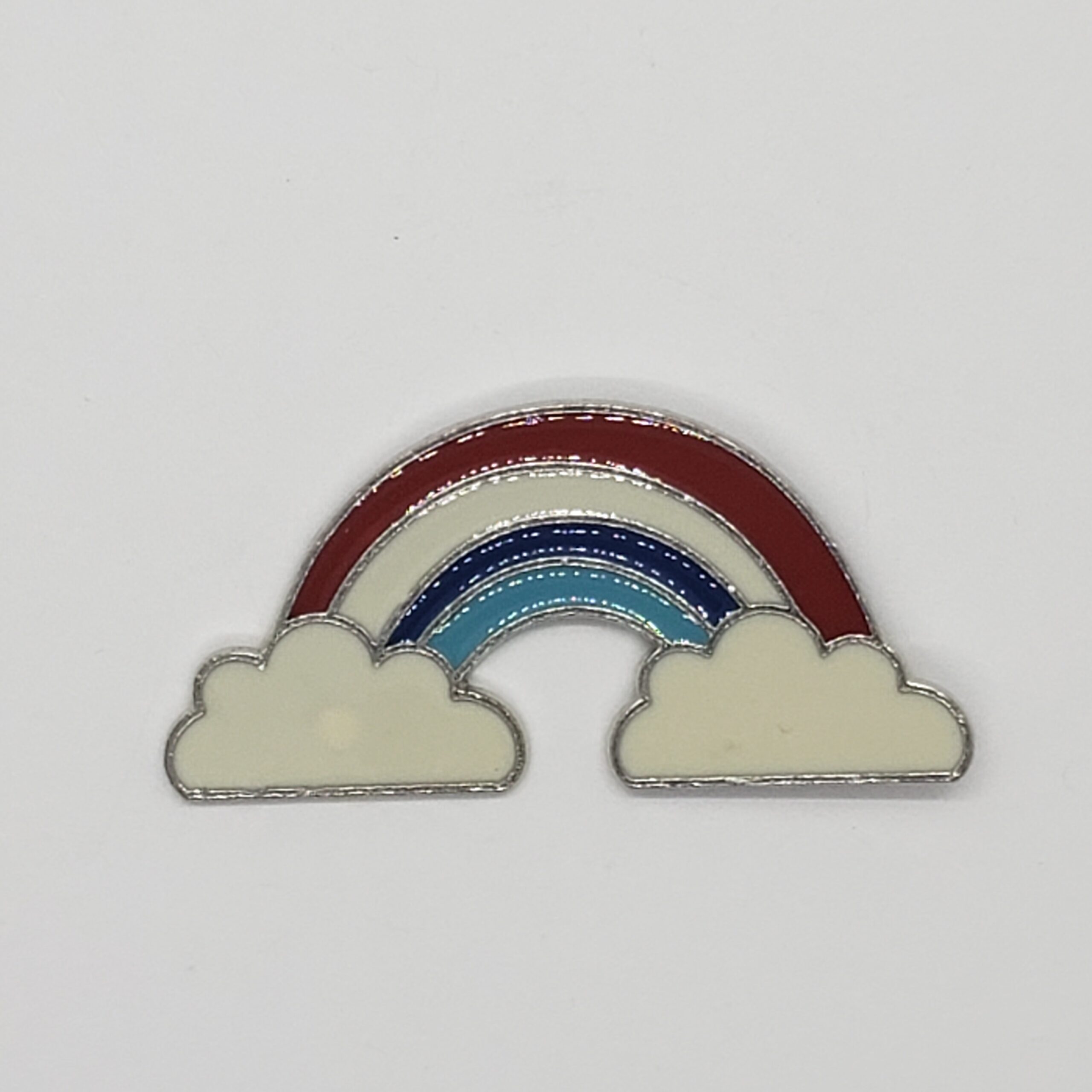 retro enamel pin. Red white and blue rainbow with a cloud at each end. 2 inches wide