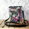 Quilted wildflower design crossbody phone bag, 8 inches long and 5 inches wide, featuring a zip closure, coordinating liner, adjustable 50-inch strap, and metal hardware.