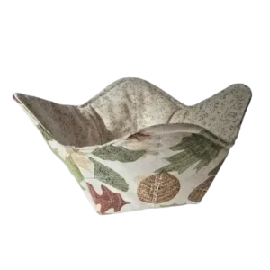 Autumn Leaves Bowl Cozy, 10-inch reversible kitchen accessory made from 100% cotton, ideal for microwave use and featuring a vibrant autumn leaves design on one side and a complementary neutral floral pattern on the other.