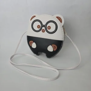 Handmade black and white character bag in vegan leather, featuring glasses, 8 inches tall, 7 inches wide, with zip closure and crossbody strap.