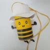 Handmade bumble bee character purse in vegan leather with white wings, matching hat, cute face, crossbody strap, and secure zip closure.