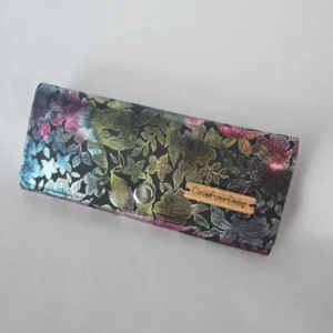 Handmade vegan leather wallet with a metallic floral pattern, silver-tone hardware, multiple pockets, and card slots.
