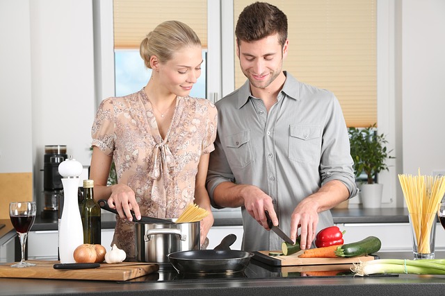 A happy couple cooking together in a modern kitchen