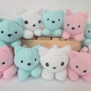 Handmade mini cat plushie, available in white, pink, and teal, featuring safety eyes and a soft, huggable design.