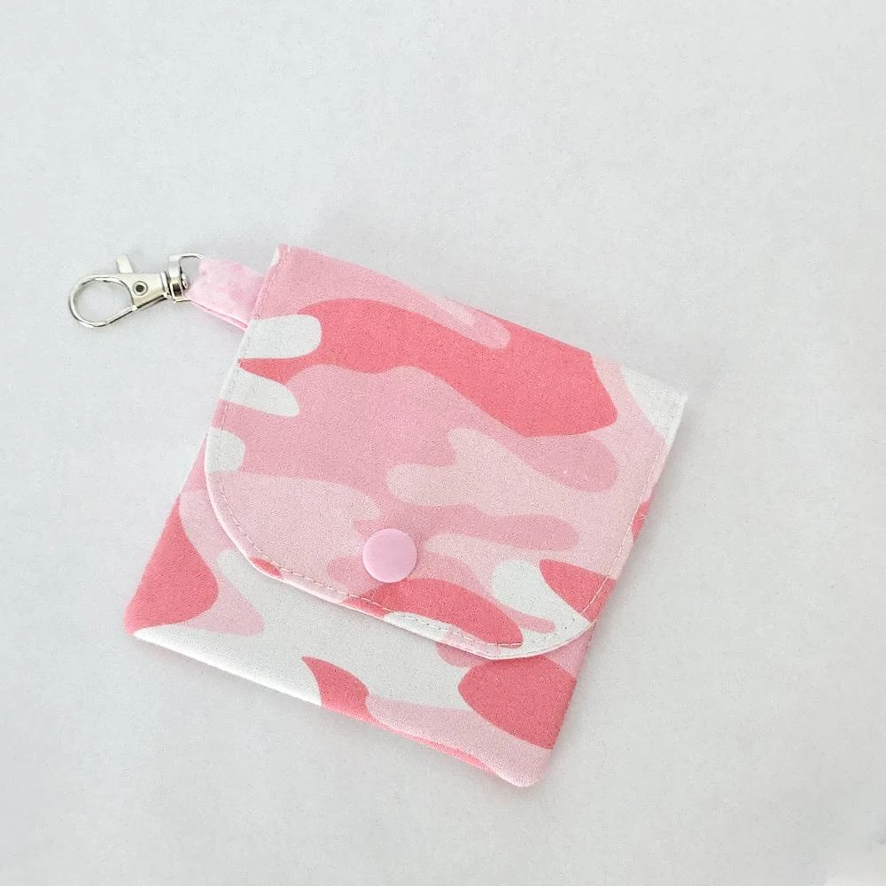Handmade Pink Camo Wallet with three pockets, a snap closure, and a lobster claw clasp. Made from fabric with a pink camouflage pattern and a coordinating pink lining.